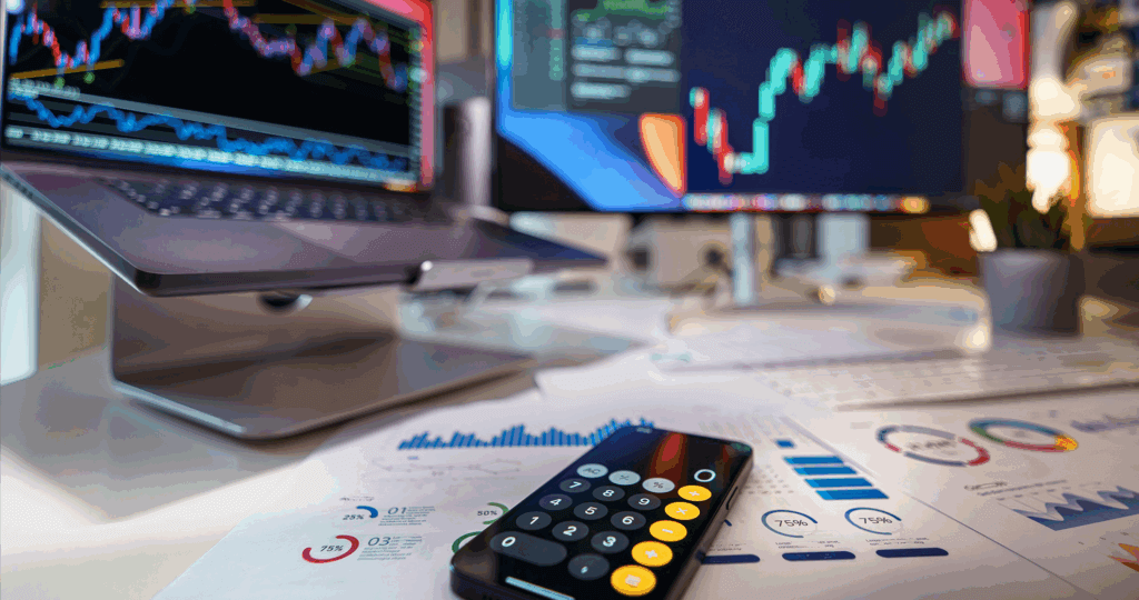 Stock market image with papers and computer on a desk